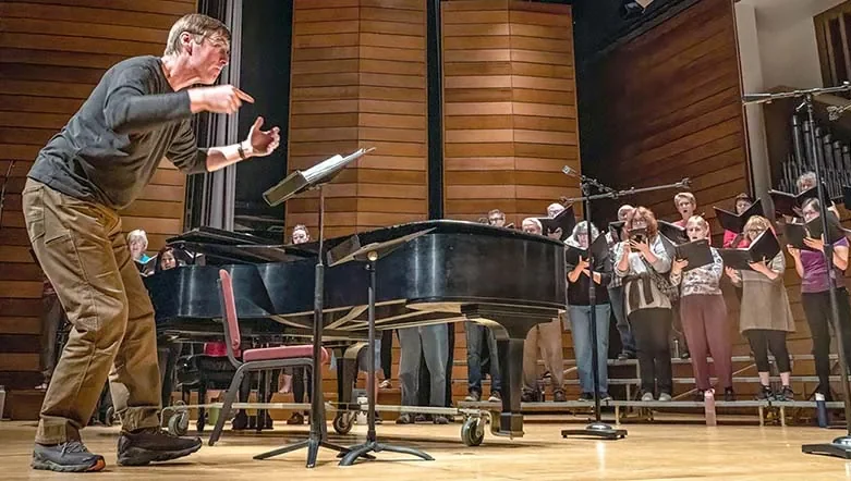 Music Director Paul French rehearses the Southern Oregon Repertory Singers for a concert at the SOU Music Recital Hall