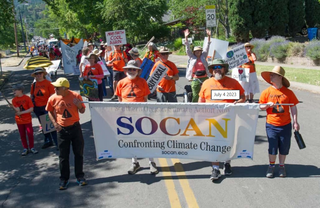 SOCAN volunteers with banner at parade in Ashland